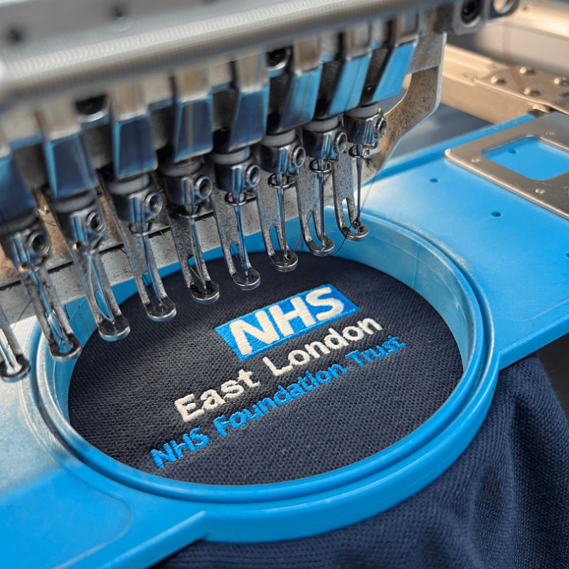 The Complete Guide to Embroidered Workwear for Small Businesses 3 polo shirt being embroidered